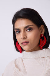 Red leather women's earrings with distinctive orchid-link metal petal